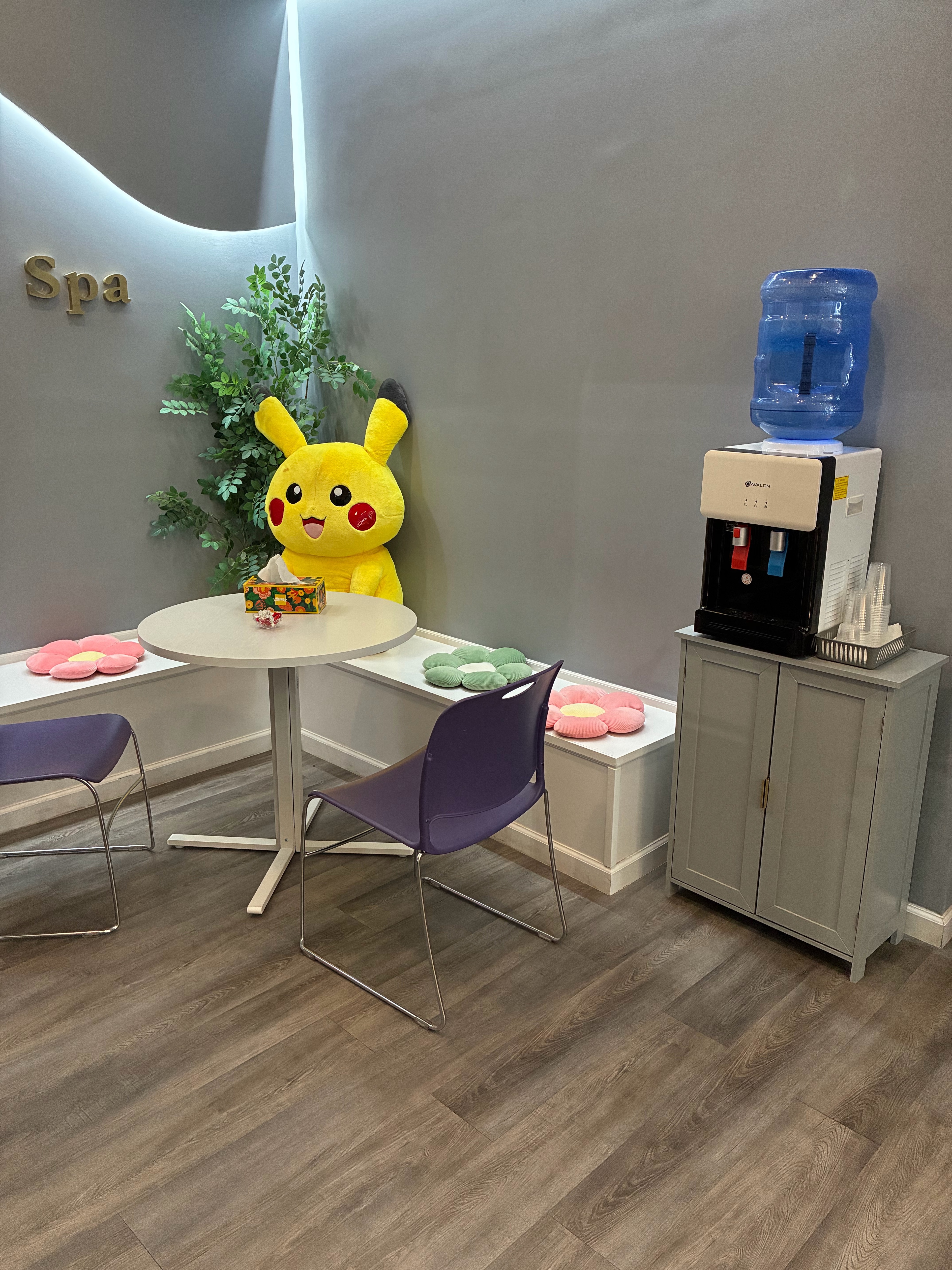 Lucky Wellness & Spa waiting area with water dispenser