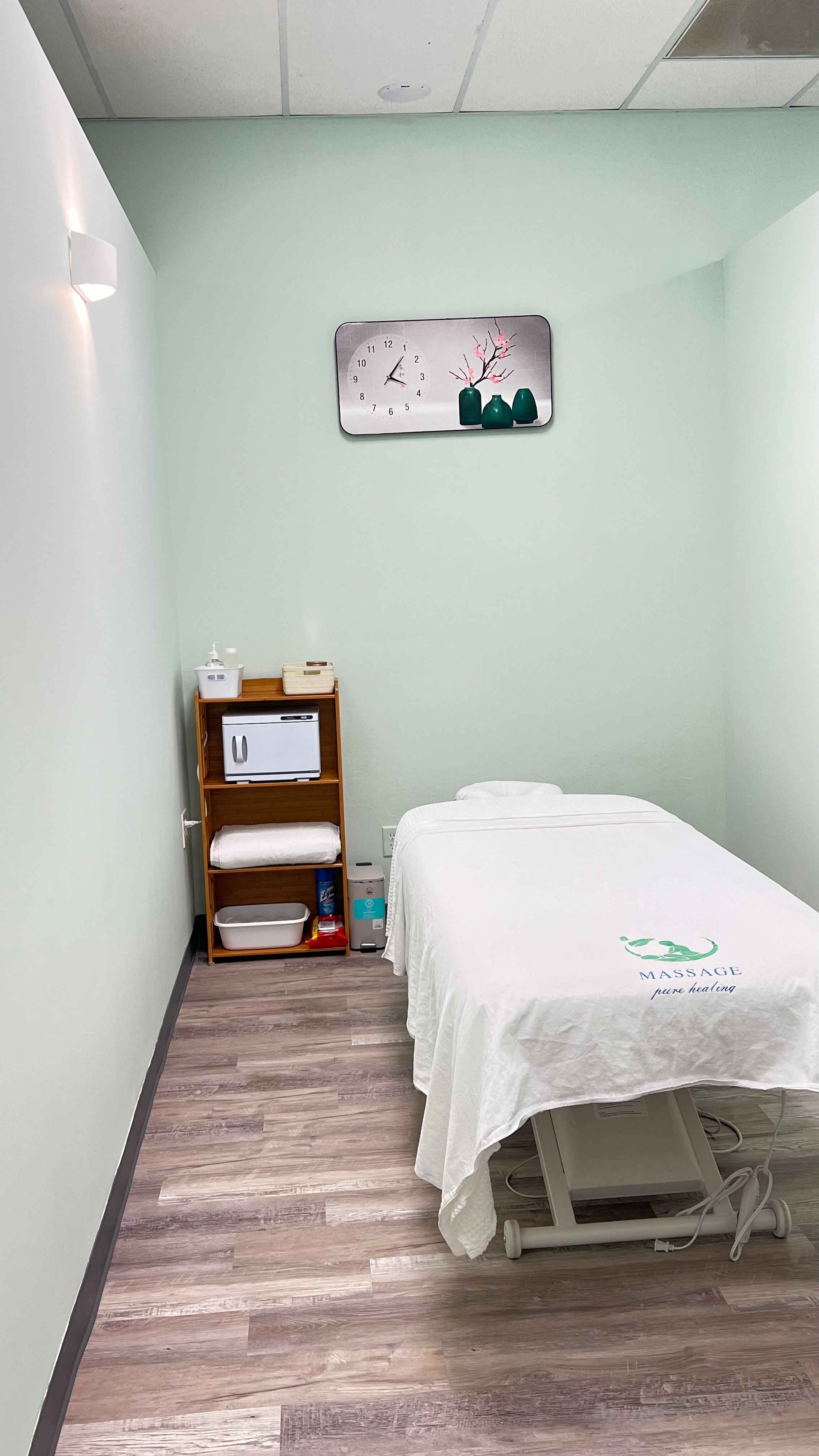 Softly lit private massage treatment room