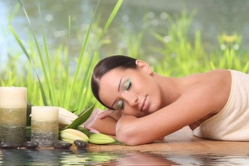 Calm, softly lit treatment room used for aromatherapy