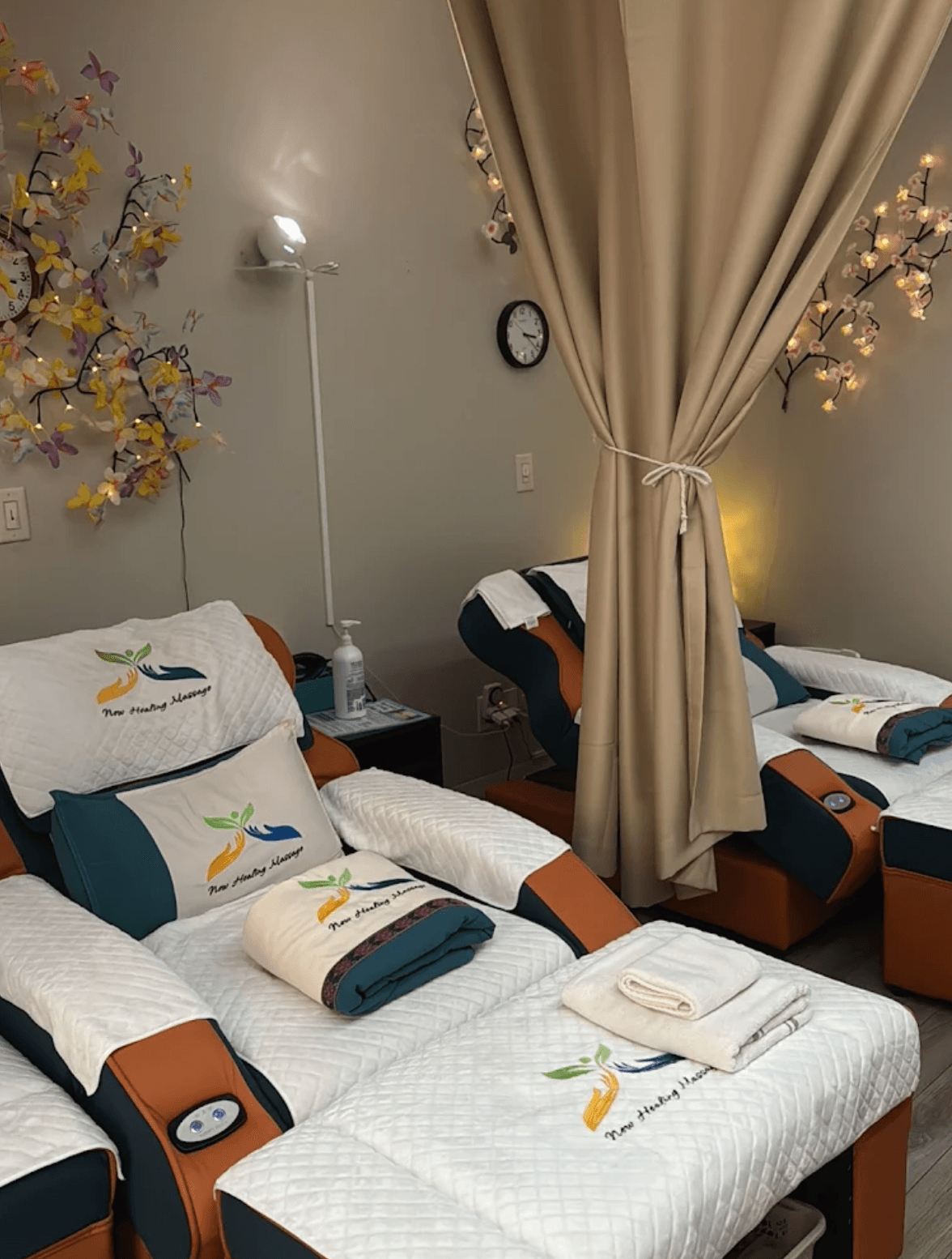 Interior of New Healing Massage showing comfortable reflexology chairs and soothing decor