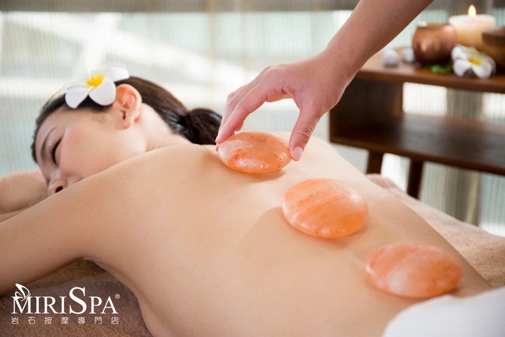 Warm spa stones arranged for a hot stone treatment